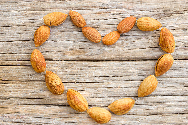 istock Heart of almonds on wood 522838737