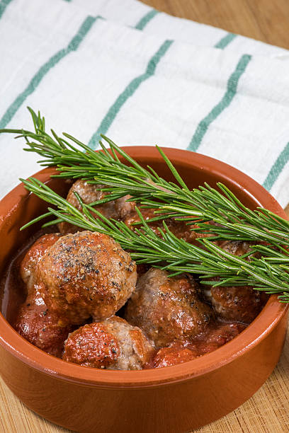 istock Croquettes in clay bowl with rosemary on kitchen towel 522849696