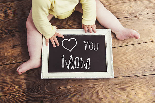 istock Mothers day composition. Picture frame. Wooden background. Studi 522849842