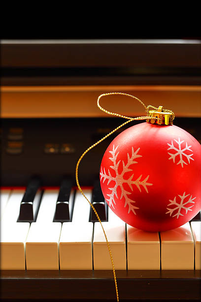 istock Christmas ball on piano keys 522851029