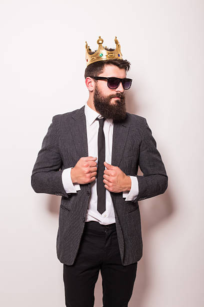 istock man in sunglasses wearing suit and crown 522851254