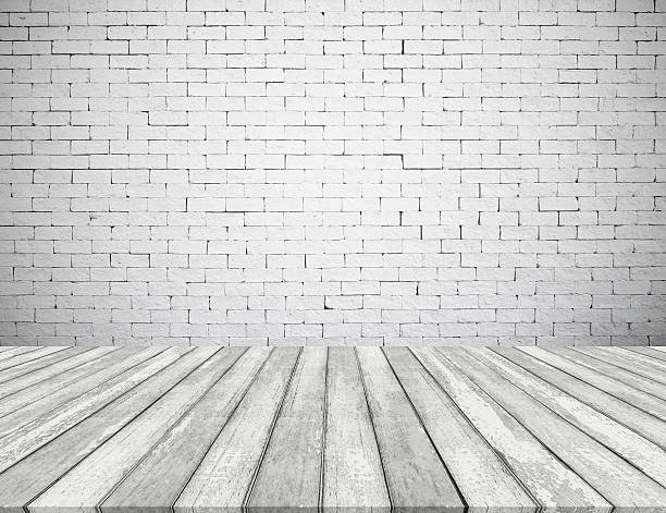 istock Room interior with white brick wall and wooden floor texture 522852014