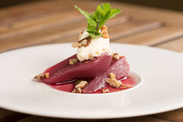 Poached pears in red wine with mascarpone & pecan nuts