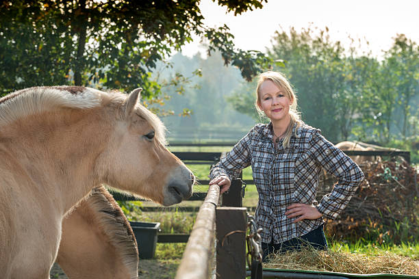 istock Woman and her horse 522852558