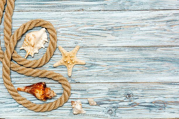 istock Marine rope and starfish on white boards 522852678