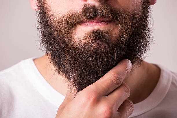 istock portrait of beard against white background 522852788