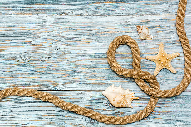 istock Marine rope and starfish on white boards 522852792