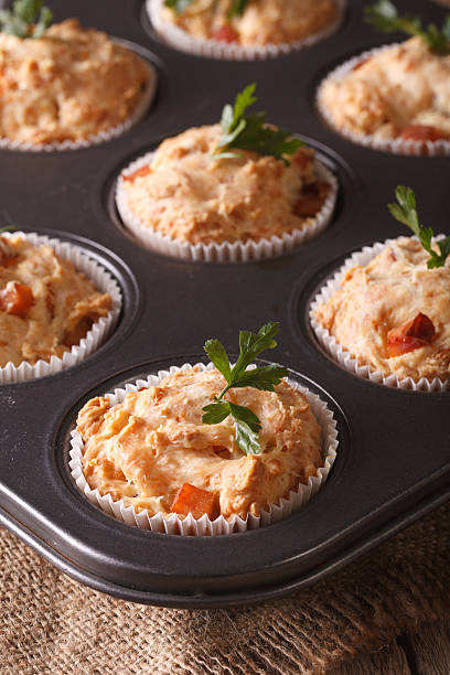 istock muffins with ham and cheese in baking dish closeup. Vertical 522853068