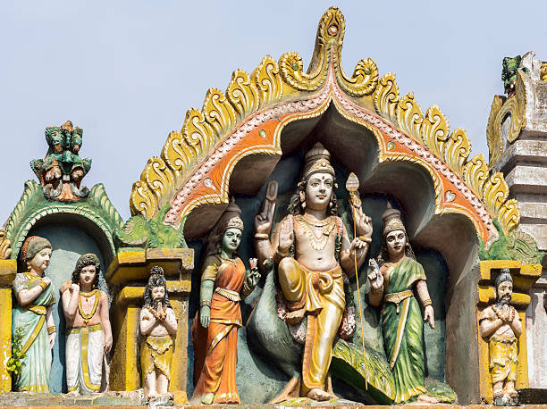 istock Lord Murugan and his two wives at Thiruvannamalai temple. 522853353