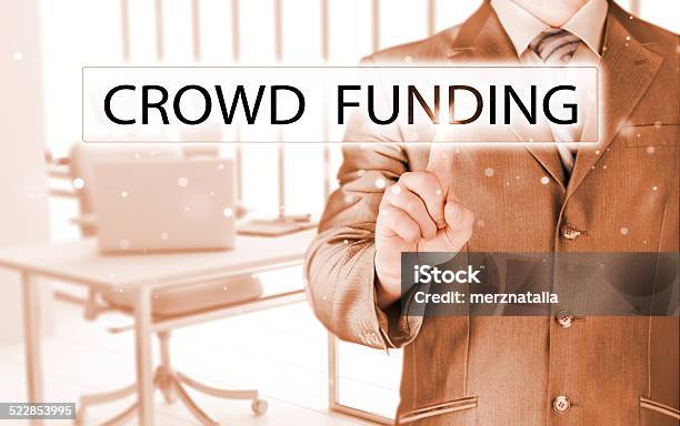 Businessman Pushes Virtual Crowd Funding Button Stock Photo - Download Image Now - Adult, Backgrounds, Bitcoin