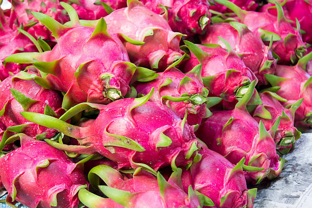 istock Dragon fruit on market stand, Thailand. 522855640