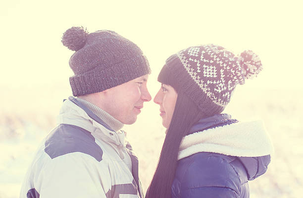 istock Loving couple looking at each other winter forest 522856144
