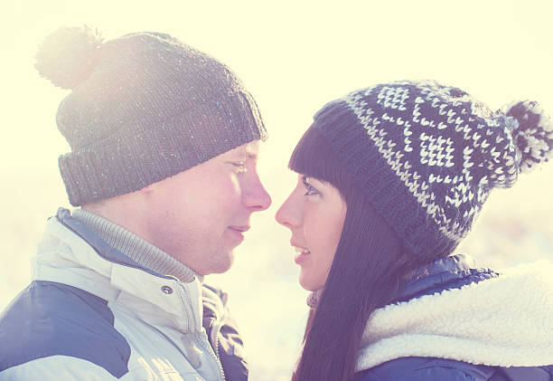 istock Young couple looking each other in winter 522856240