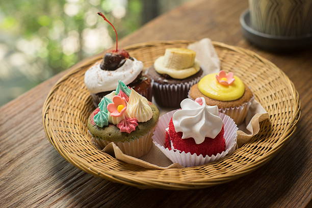 istock Cupcakes with hot chocolate on old wooden table. 522856836