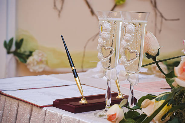 istock Wedding glasses with champagne on festive table 522857782