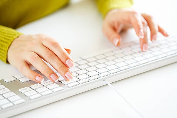 istock Woman office worker typing on the keyboard 522858524