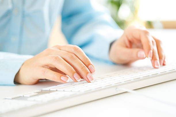 istock Woman office worker typing on the keyboard 522858648