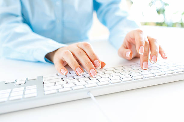 istock Woman office worker typing on the keyboard 522858772
