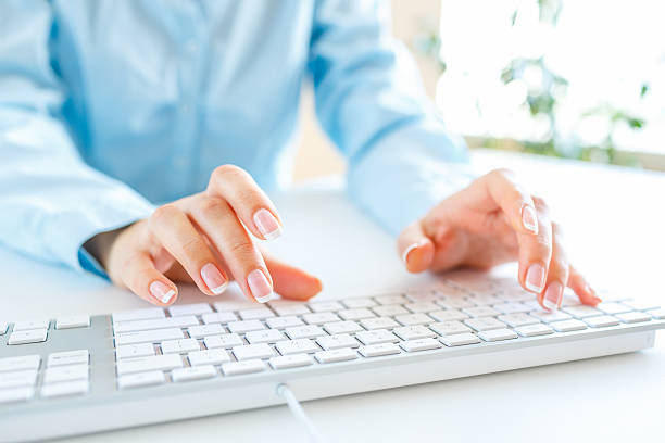 istock Woman office worker typing on the keyboard 522858858