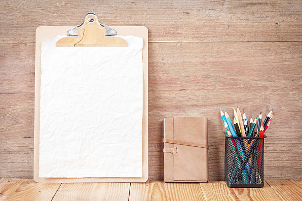 istock Notebook with clip board wooden background, Business template 522860104