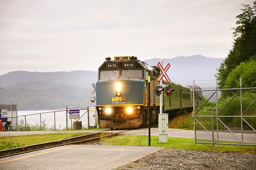 Prince Rupert, Canada - June 26, 2011: Passenger train to Prince George approach to the platform by the port at early morning time.