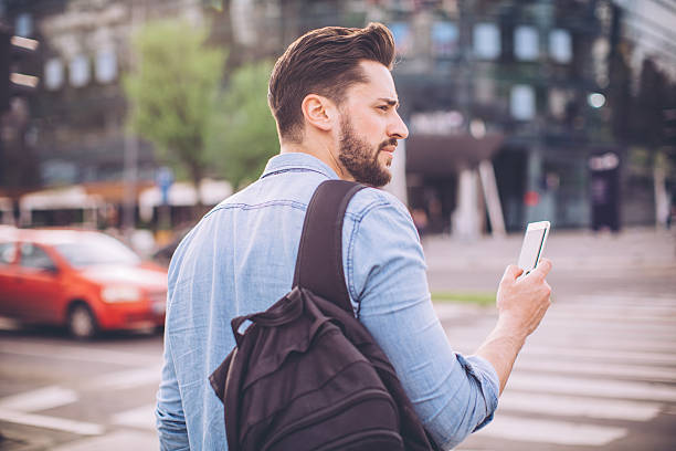 istock Young man waiting for taxi 522864844