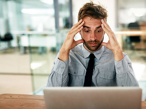 istock The deadline is getting the better of him 522865640