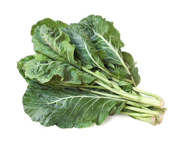 Collard greens Bunch of collard greens isolated on white kale stock pictures, royalty-free photos & images