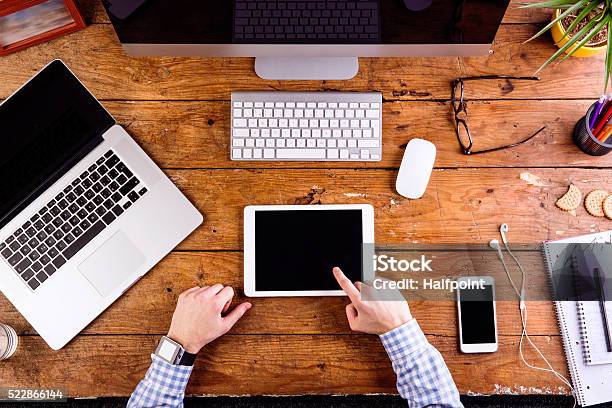 Business Person Working At Office Desk Wearing Smart Watch Stock Photo - Download Image Now