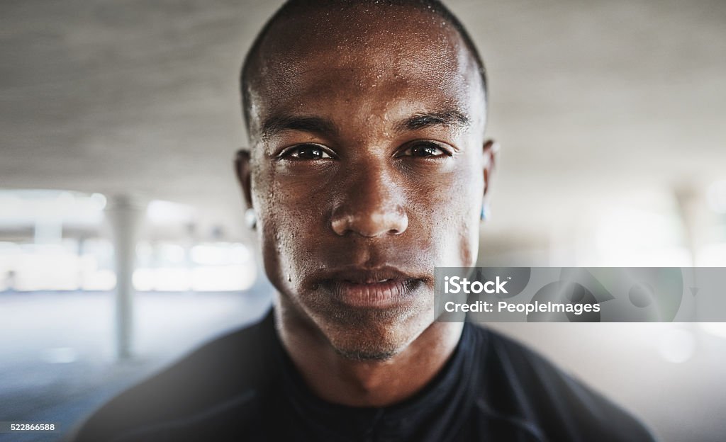 Do you want it bad enough? Portrait of a sporty young man looking serious while out for a run Sweat Stock Photo