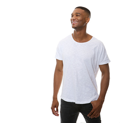 Portrait of a handsome young man smiling at copy space isolated white background
