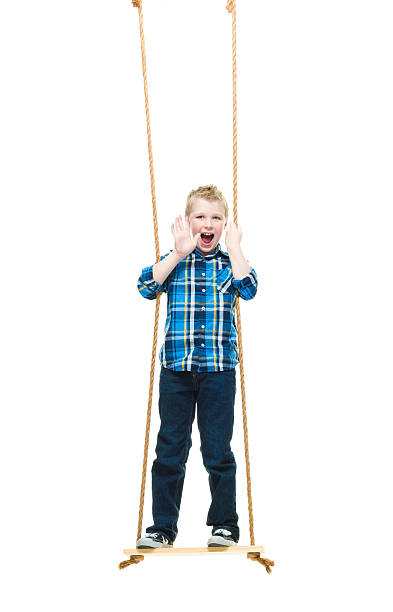 istock Smiling little boy swinging and waving hand 522868064