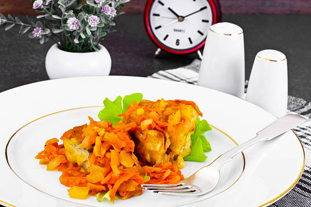 istock Fish in Greek with Onion and Carrot 522868282