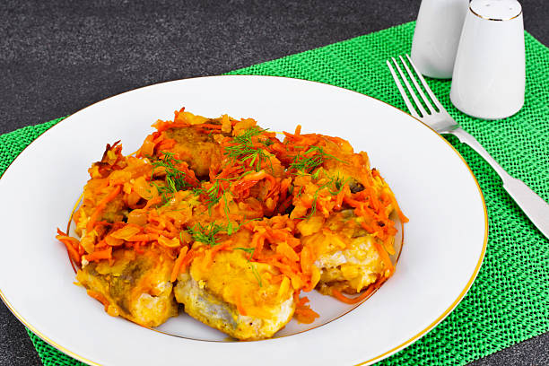 Fish in Greek with Onion and Carrot Fish in Greek with Onion and Carrot Studio Photo Celeriac stock pictures, royalty-free photos & images
