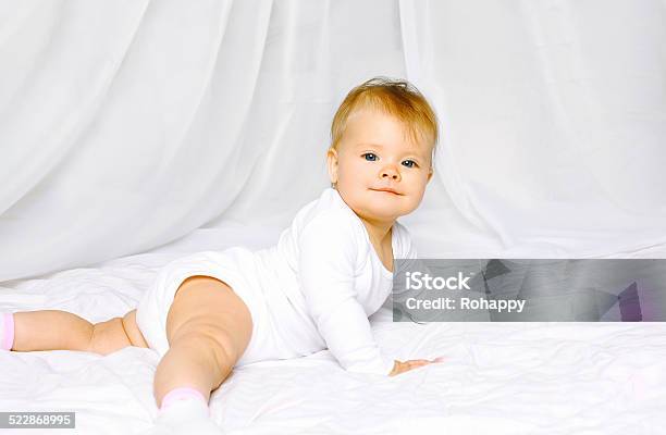 Portrait Cute Baby Lying On The Bed Home Stock Photo - Download Image Now - 12-17 Months, Activity, Baby - Human Age