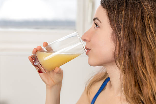 istock Woman enjoying her fresh fruit juice 522870300