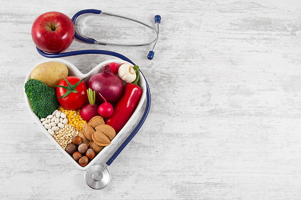 istock Healthy Foods in Heart Shaped with Stethoscope 522870830