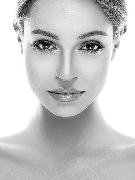 istock Beautiful woman face close up studio black and white 522871638