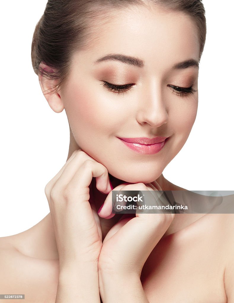 Beautiful woman face close up portrait happy studio on white Woman clear skin beautiful face perfect make-up portrait Adult Stock Photo