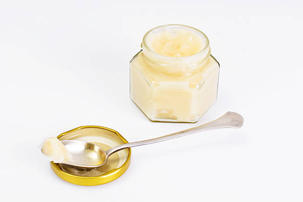 istock Glass Jar with Cream Honey Bee 522872808