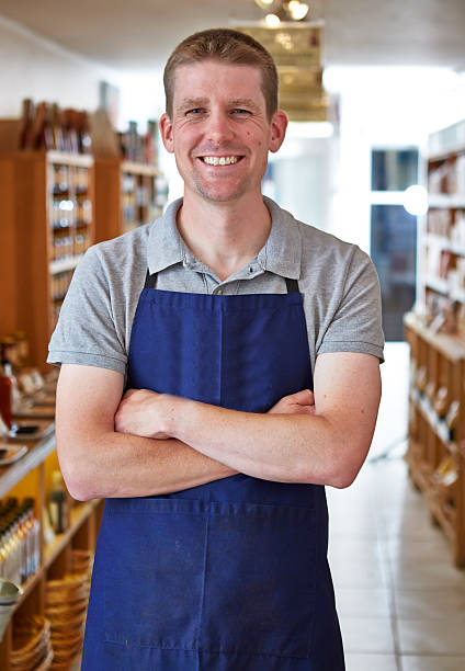 istock Happy shop keeper in delicatessen 522872939