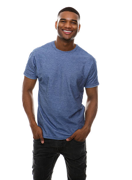 Cool guy smiling Portrait of a cool guy smiling on isolated white background hands in pockets stock pictures, royalty-free photos & images