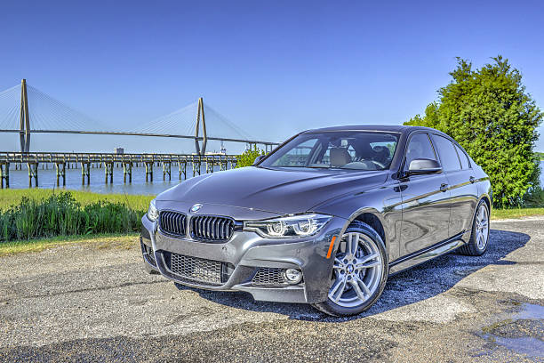 BMW 340i 2016 11 Mt Pleasant, South Carolina, USA - April 17, 2016: This is a picture of the new Bmw 3 series sedan 340i and is an example of the brand new 2016 model. Shot outdoors in the morning at Remley's Point in Mt Pleasant, SC. The Cooper River Bridge is seen in the background. bmw stock pictures, royalty-free photos & images