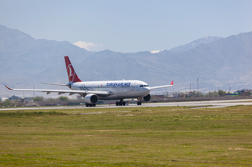 Kabul, Afghanistan - April 22, 2016:Airbus A330-300 passenger airplane of Turkish Airlines is on runway before take off in Kabul International Airport.
