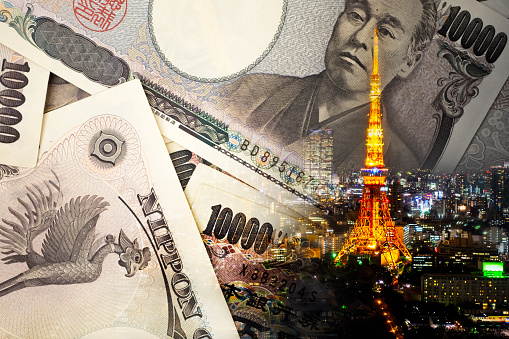 Double exposure of TOKYO TOWER , note bank , yen note, japan money concept