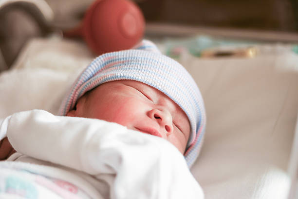 istock One day old baby sleeping, New born baby 522879334