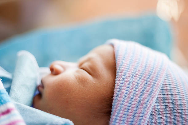 istock Close up sleeping newborn in hospital, selective focus. 522879588