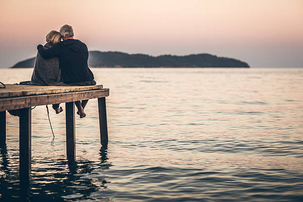 istock Loving senior couple enjoying the sunset 522886345