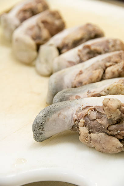 istock Row of cooked pig tongues 522887205