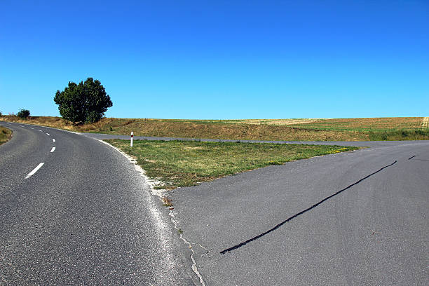 istock asphalt road triangle crossroad in nature 522887343